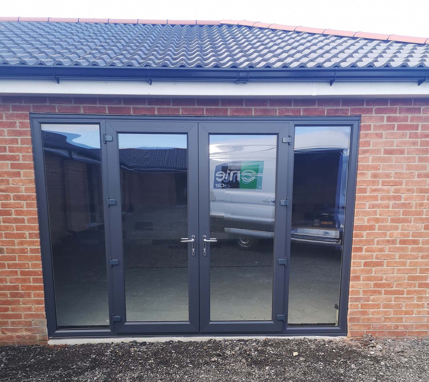 dark grey full length window doors on extension