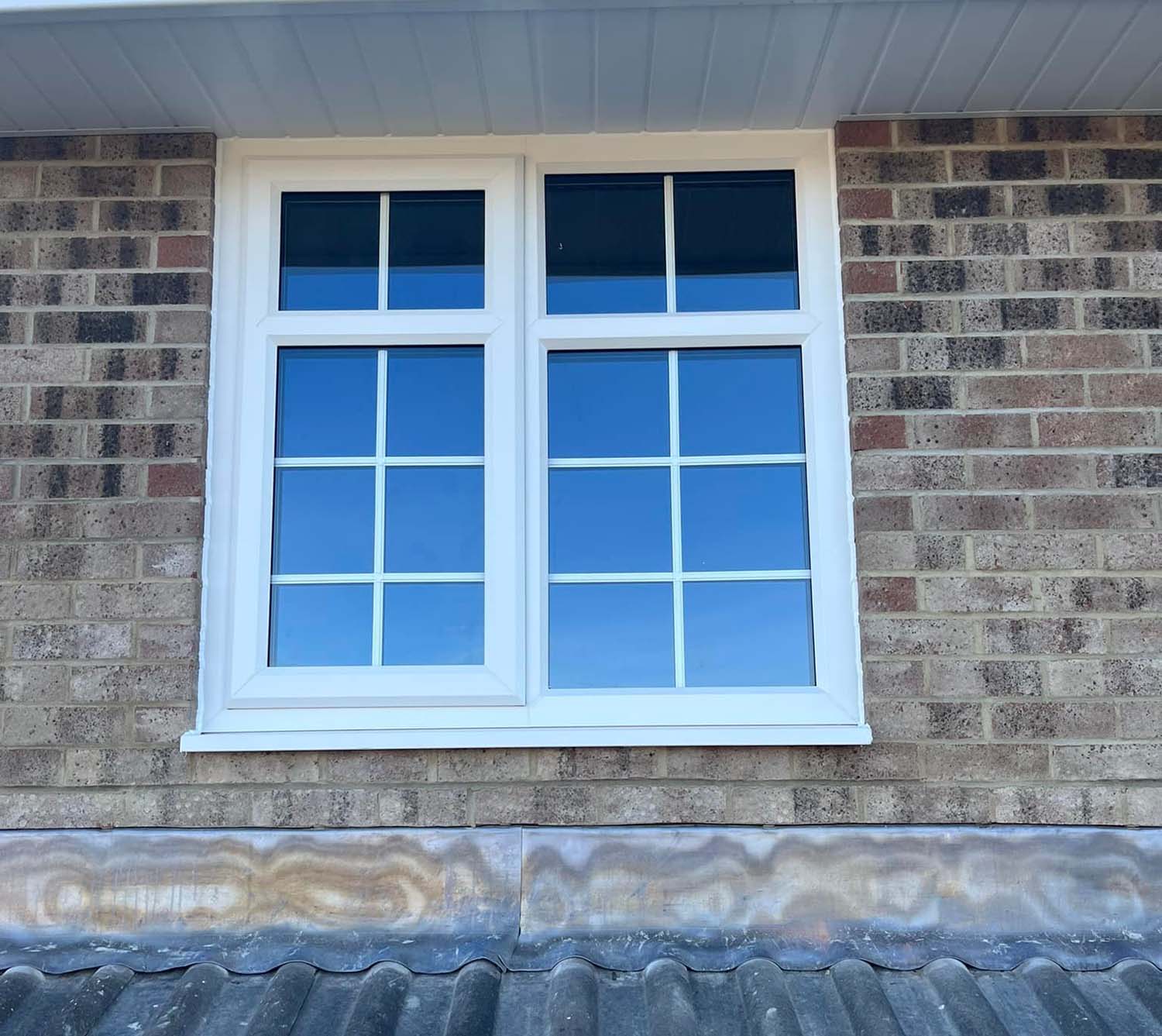 White upvc windows in bedroom of house